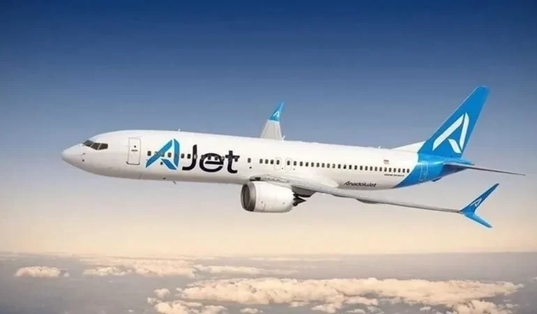 AJet logolu yolcu uçağı bulutların üzerinde uçarken
